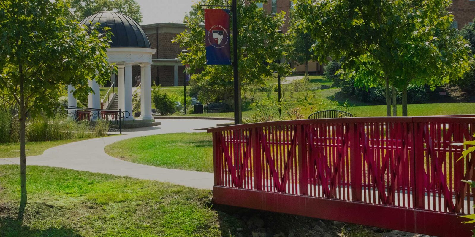 su_home_hero Red bridge and gazebo outside Shenandoah University