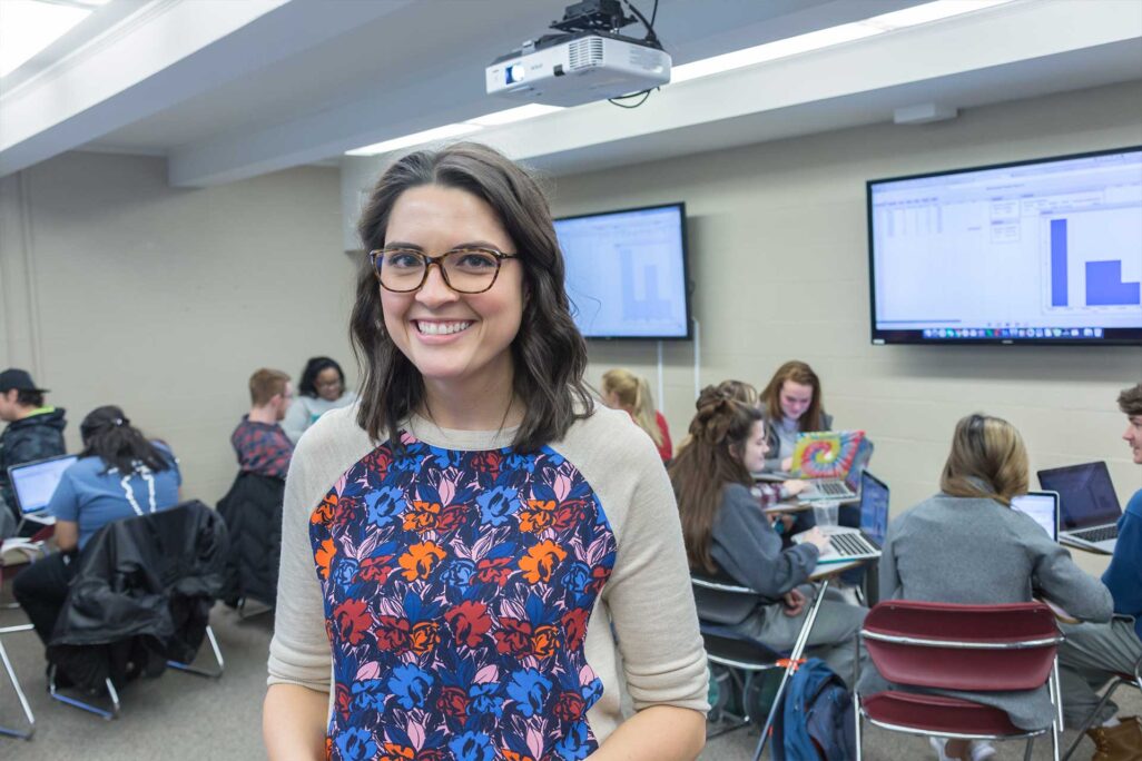 su_about_image-1 Student at Shenandoah University smiling in classroom